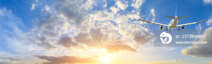 Airplane in the sky at sunrise