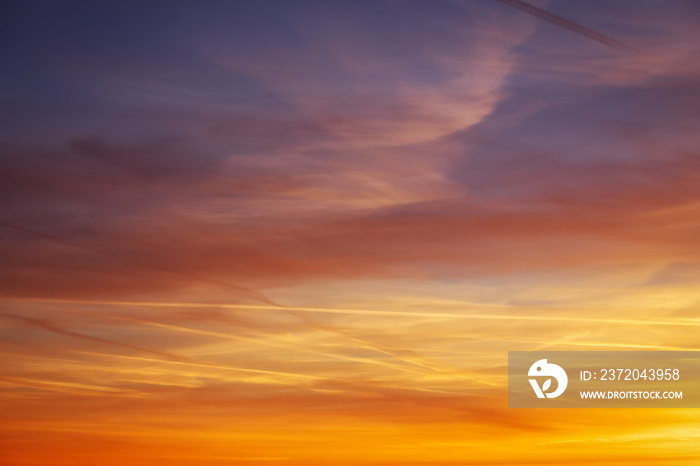 Fiery orange colorful sunset sky as background