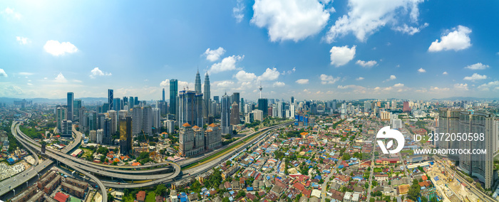 Modern Skyscraper and Traditional Housing Area at Kuala Lumpur, Malaysia