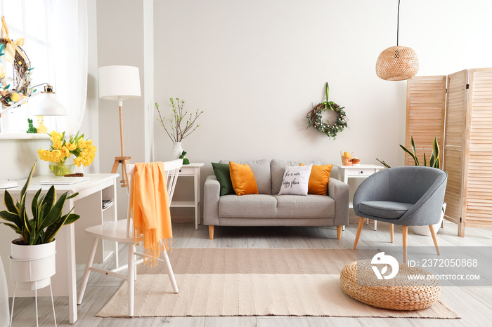 Modern interior of living room decorated for Easter celebration