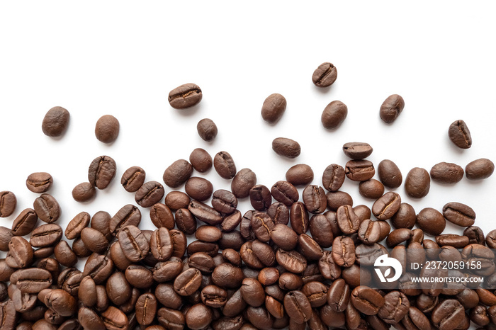 Roasted coffee beans on white background. Close-up.