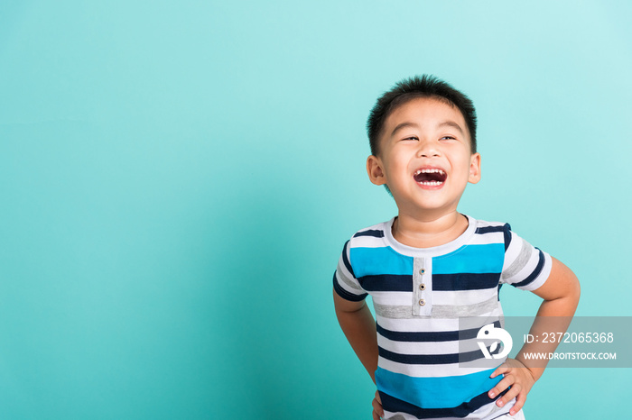 Asian portrait of cute little boy kid happy face he laughing smiles and looking to camera, studio sh