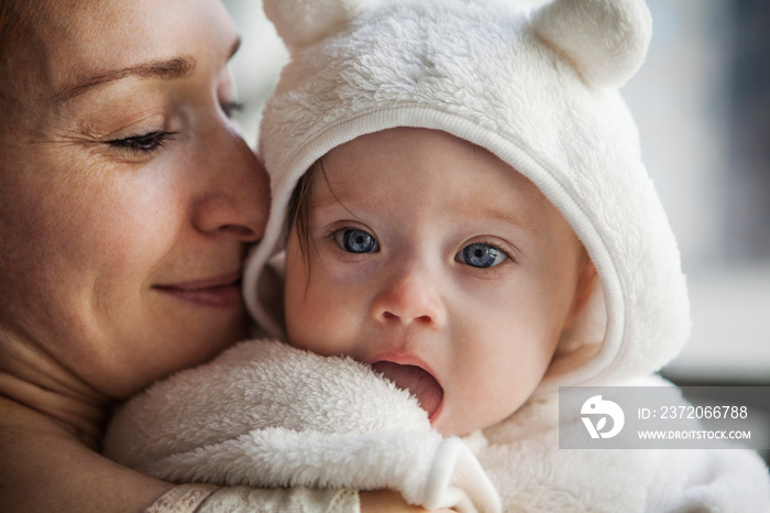 Close up of mother holding baby girl