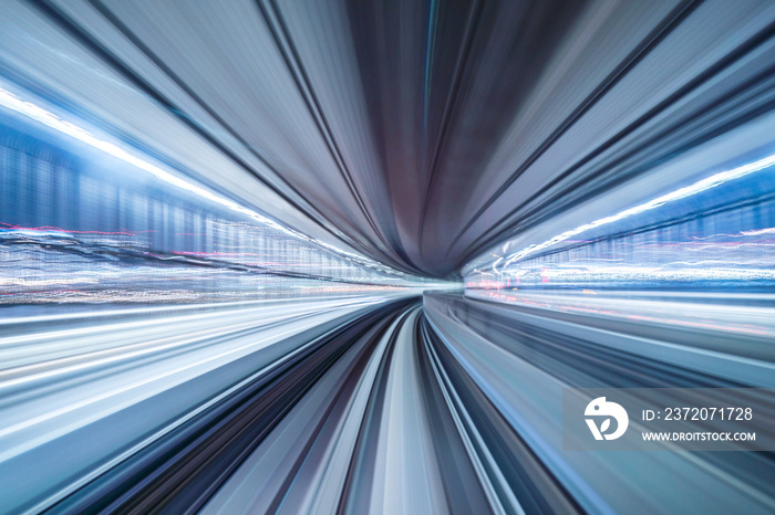 Motion blur of train moving inside tunnel with daylight in tokyo, Japan.