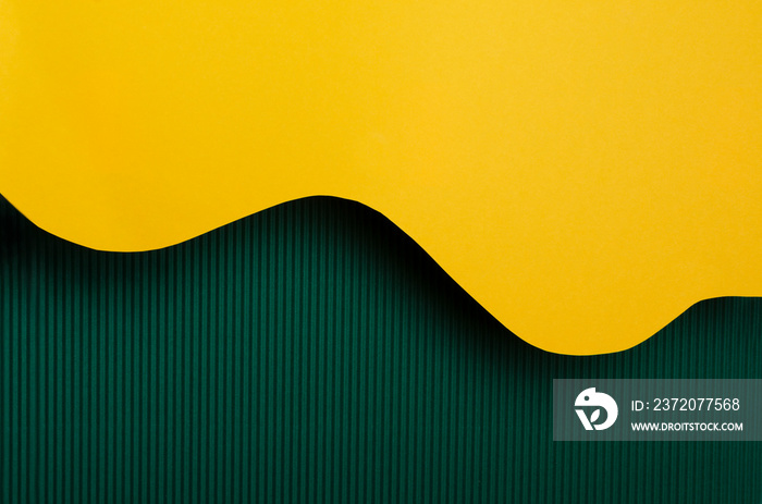 Abstract background made of colorful paper. Dark green and shiny yellow background.Empty space for t