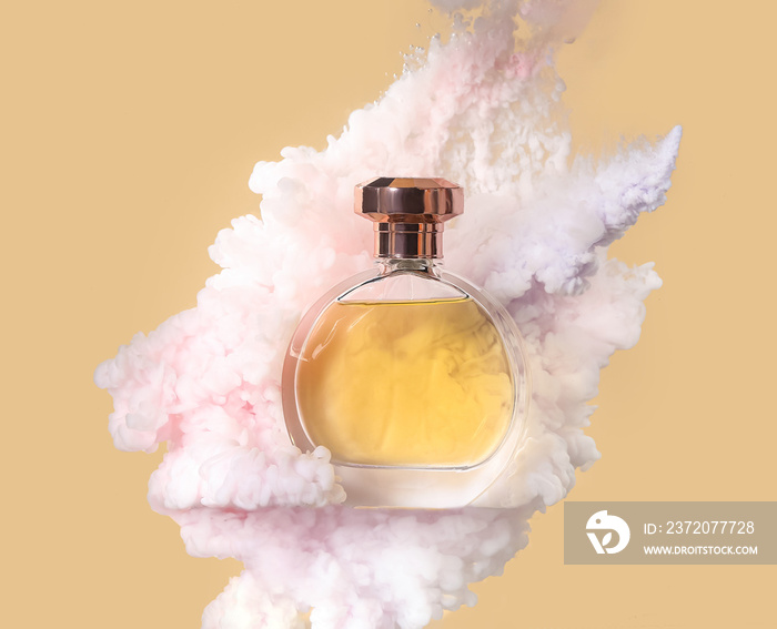 Perfume bottle in light smoke on beige background