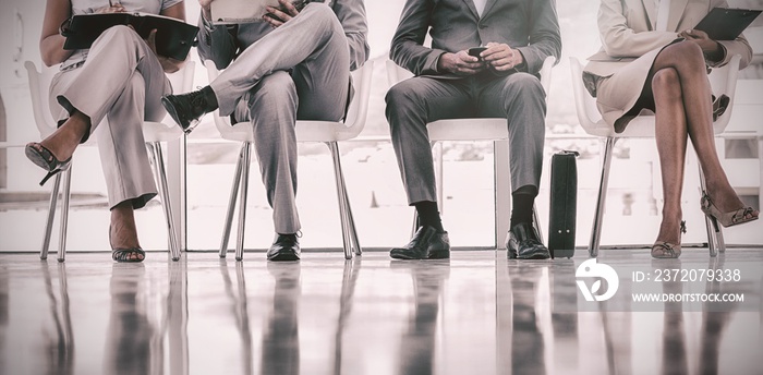 Group of well dressed business people waiting