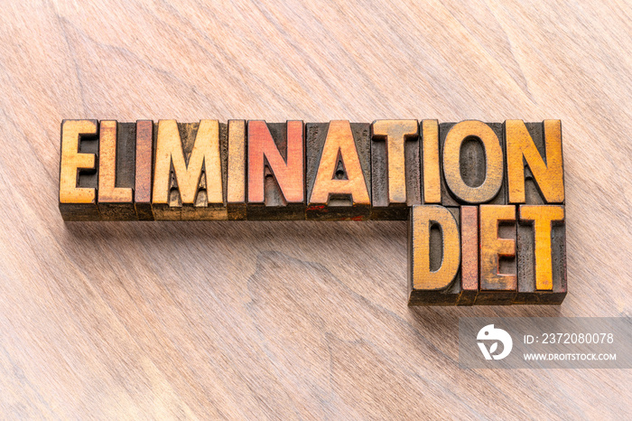 elimination diet word abstract in wood type