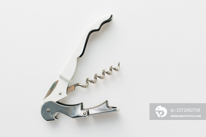 Metal corkscrew on white background