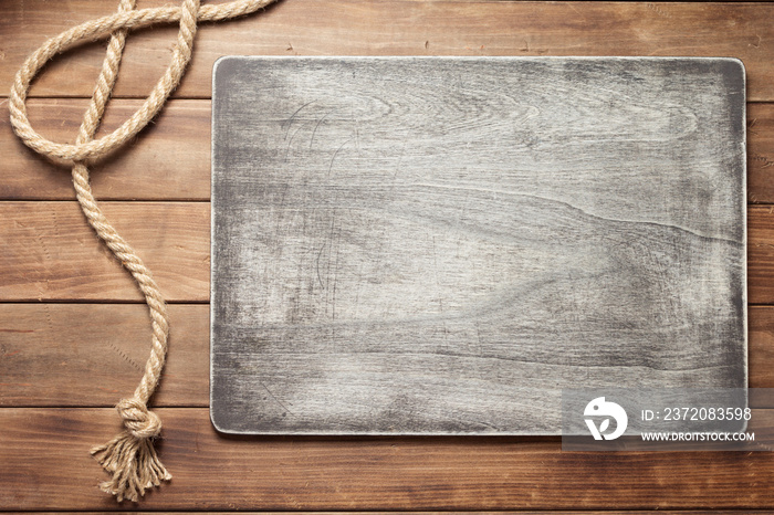 ship rope at wooden board background