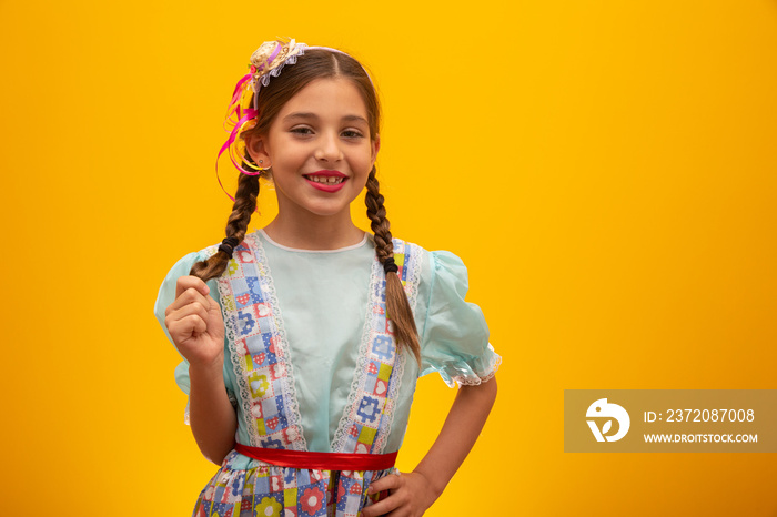 Child in typical clothes of famous Brazilian party called  Festa Junina  in celebration of São João.