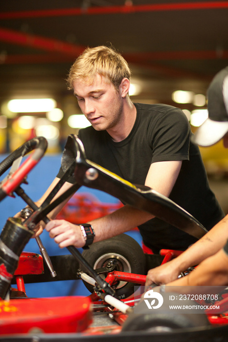 Mechanics repairing  go cart