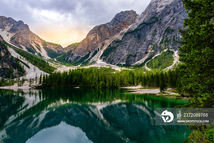 Lake Braies also known as Pragser Wildsee  in beautiful mountain landscape. Sun and cloud scenery at