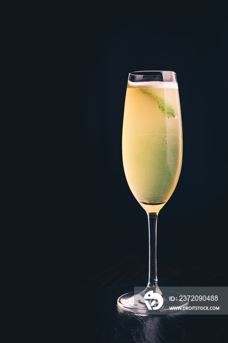 Drink with lime and mint in a champagne glass