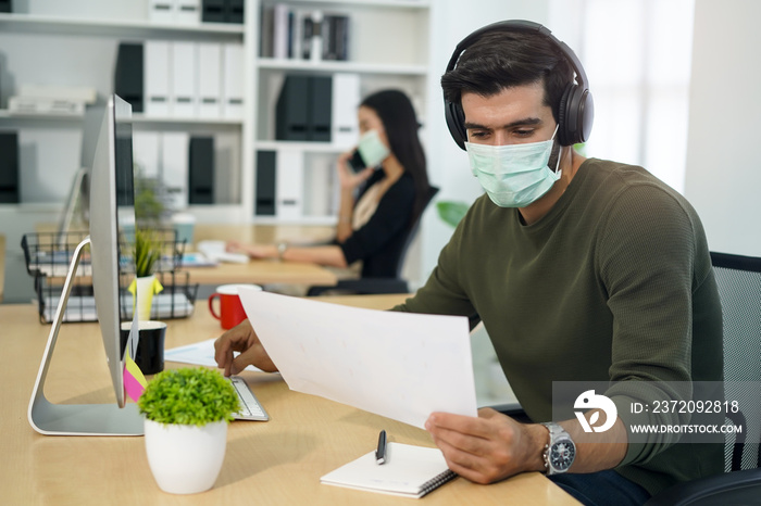 people wearing face mask and work at office