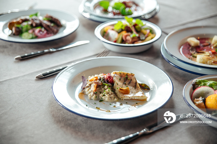 Table served with restaurant dishes chicken rice