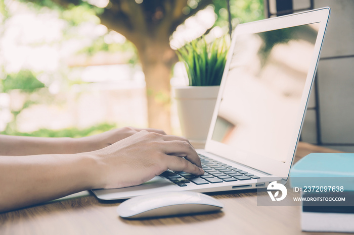 Hand of business man working from home using laptop computer to internet online on desk, lifestyle o