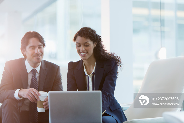 Corporate business people working at laptop