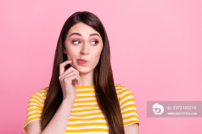 Photo of disagree young lady look empty space wear orange t-shirt isolated on pastel pink color back