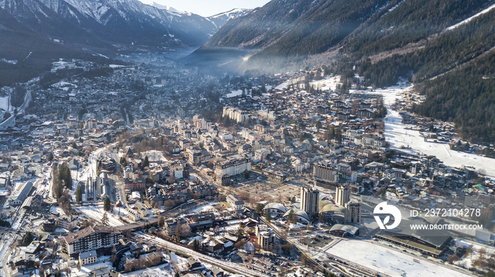 Aerial drone view of snow covered Chamonix city in the afternoon