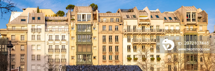 Paris, typical facade and windows, beautiful buildings in the Marais