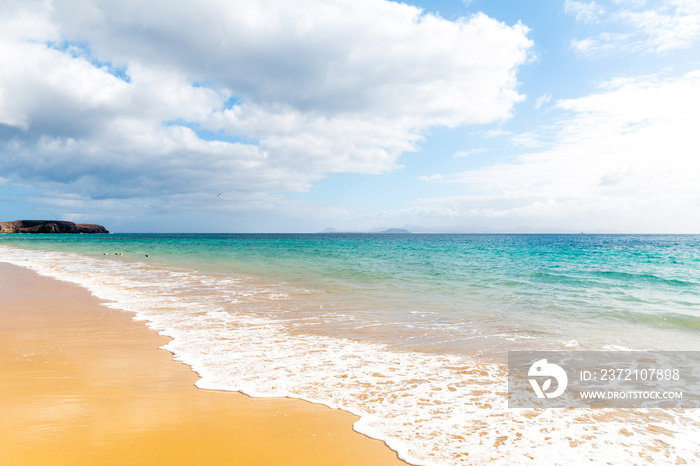 Panorama of beautiful beach and tropical sea of Lanzarote. Canaries