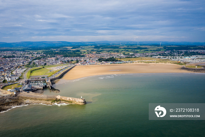 Aerial view of Porthcawl beach harbour and fun fair in South Wales UK