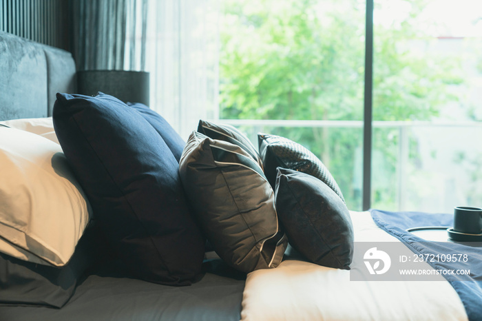 close up white beige soft pillows on bed and blanket bedroom interior design concept.bed maid luxury