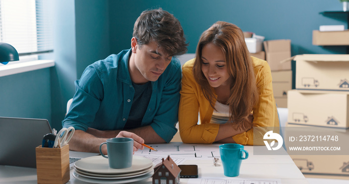 Young couple working on their house project together