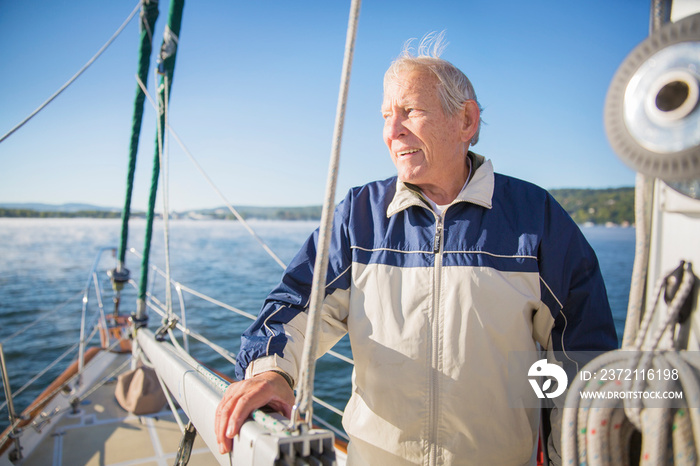 Senior man sailing in lake