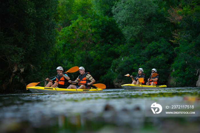 Two pairs canoing together