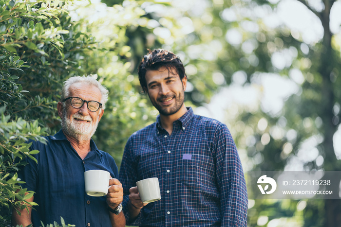 Old father and son, Morning coffee in a garden