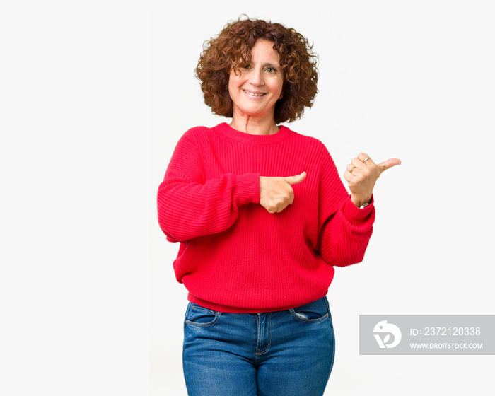 Beautiful middle ager senior woman red winter sweater over isolated background Pointing to the back 