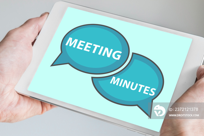 Meeting minutes concept with hands holding modern tablet or smartphone to be used as slide backgroun