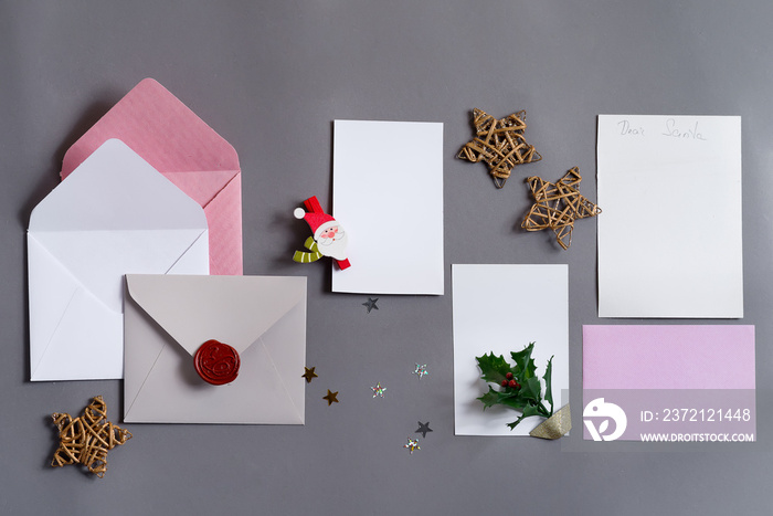 Christmas mockup cards with envelopes and holiday decoration.