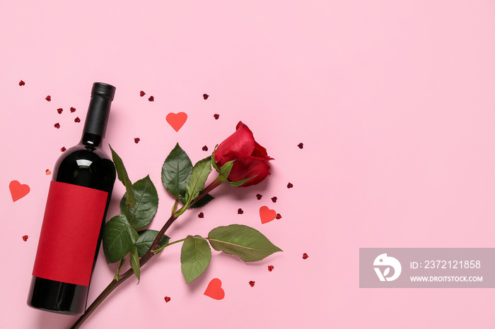 Bottle of wine and rose for Valentines Day on pink background