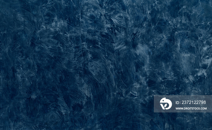 美丽抽象的Grunge装饰海军蓝深色灰泥墙背景。