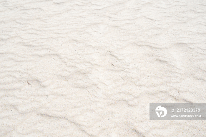 Detail of texture sand in tropical island Summer background and travel design.