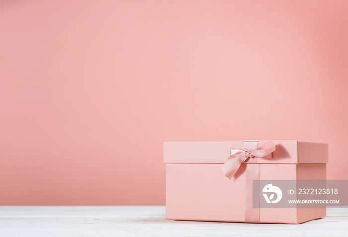 Pink gift box on pink background