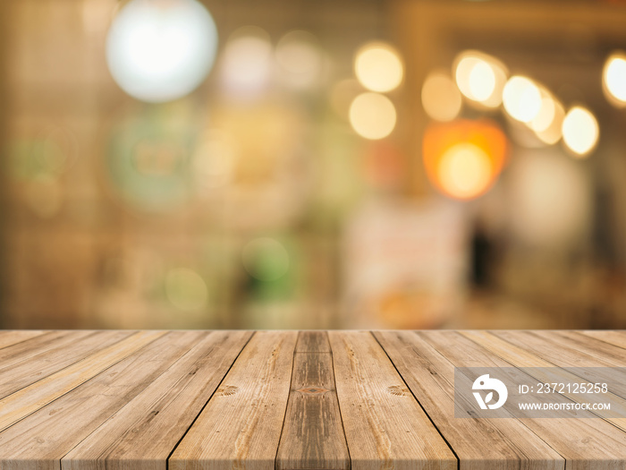 Wooden board empty table in front of blurred background. Perspective brown wood over blur in coffee 