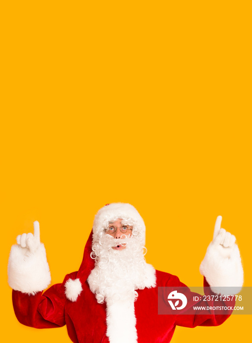 Creative Christmas card with Santa Claus indicating on copy space