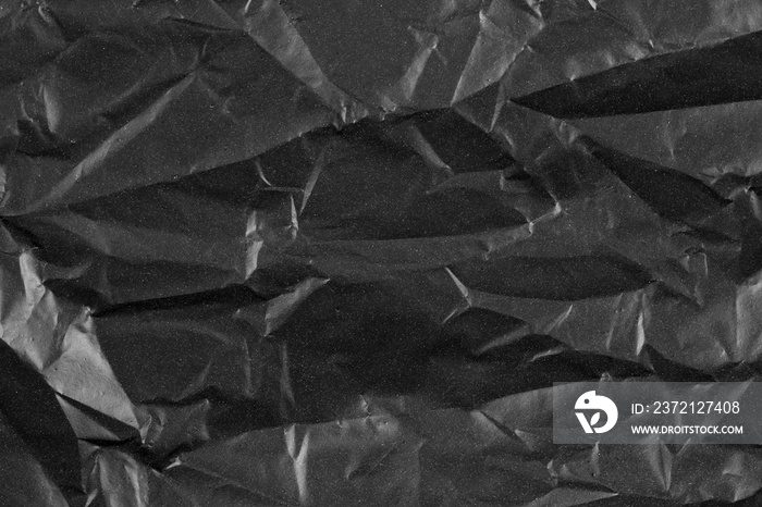 Abstract background crumpled plastic film texture black garbage bag