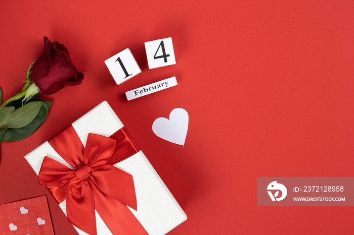 Valentines day flat lay on red background. Valentines day background: February 14, flowers, gift, 