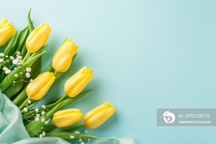 Top view photo of womans day composition bunch of yellow tulips white gypsophila and soft textile o