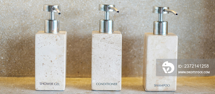 Toiletries bottles in bathroom at luxury hotel or modern home. shower container set, body shower gel