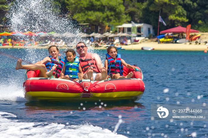 Family water sport adventure on the sea