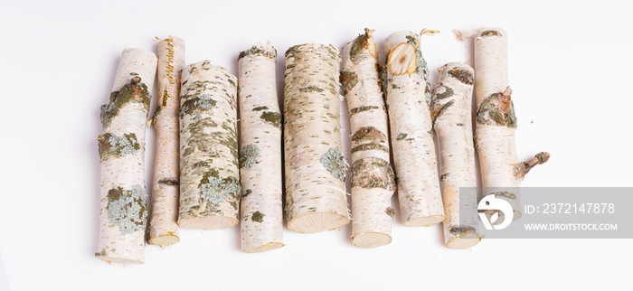 A pile of birch firewood on white background