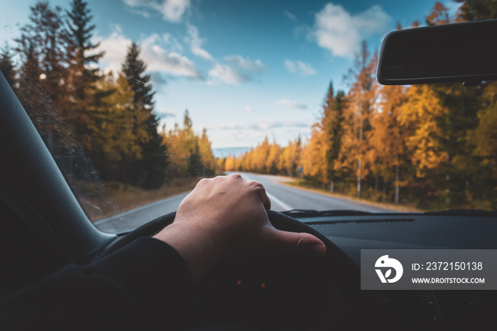 Autumn road view from the cars cab. Photo from Sotkamo, Finland.