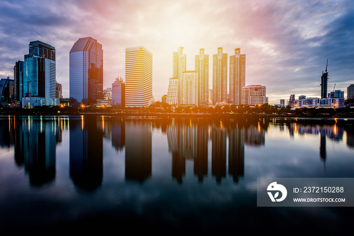 City building with water reflection before sunset