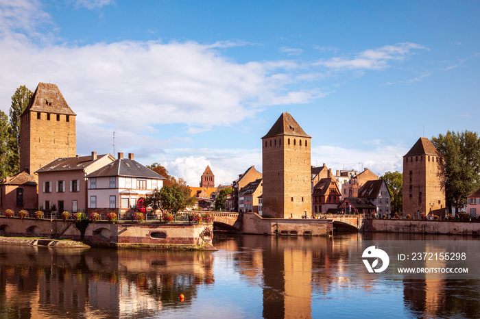 Ponts Couverts in Strasbourg. View on the towers reflecting in water, picturesque landscape of Stras